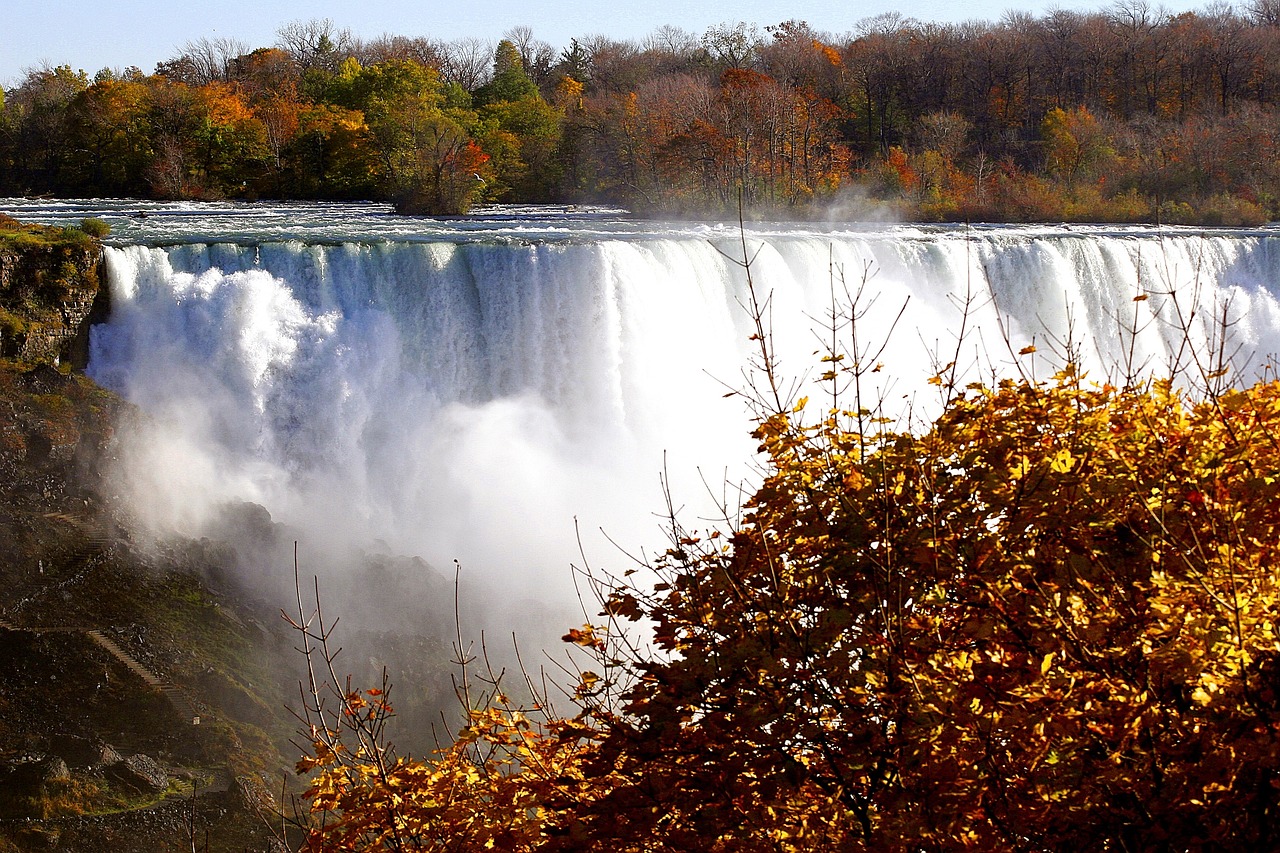 Waterfall surrounded by autumn foliage.